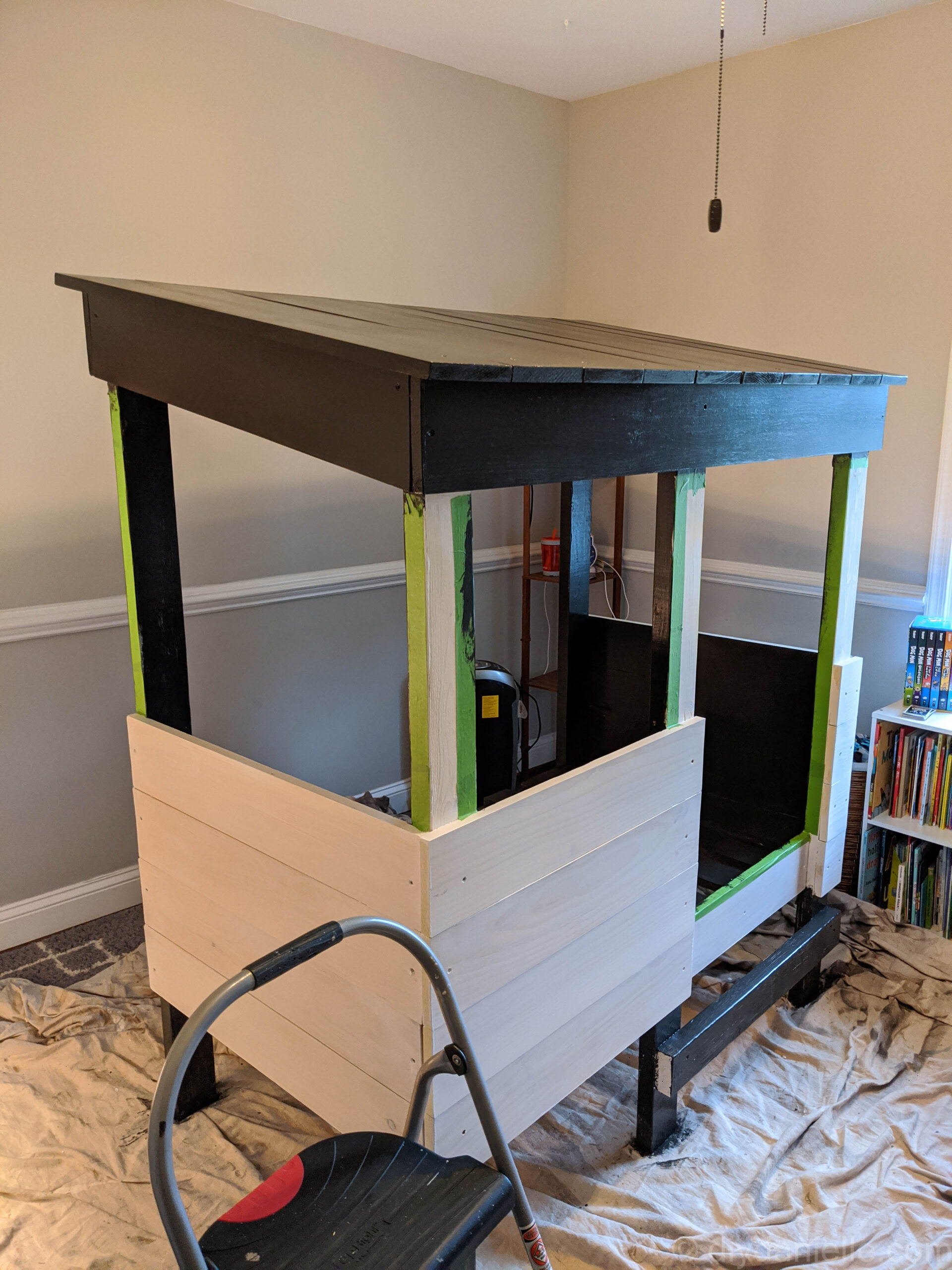 Toddler treehouse bed primed and partially painted.