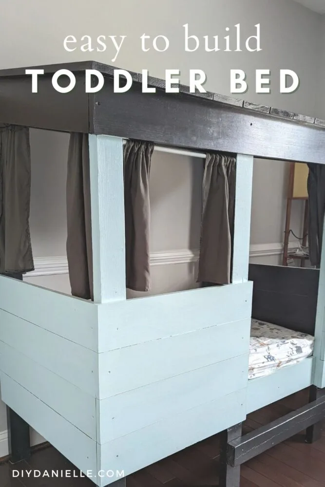 Easy to Build Toddler Bed: Black roof, light blue sides, and gray curtains.
