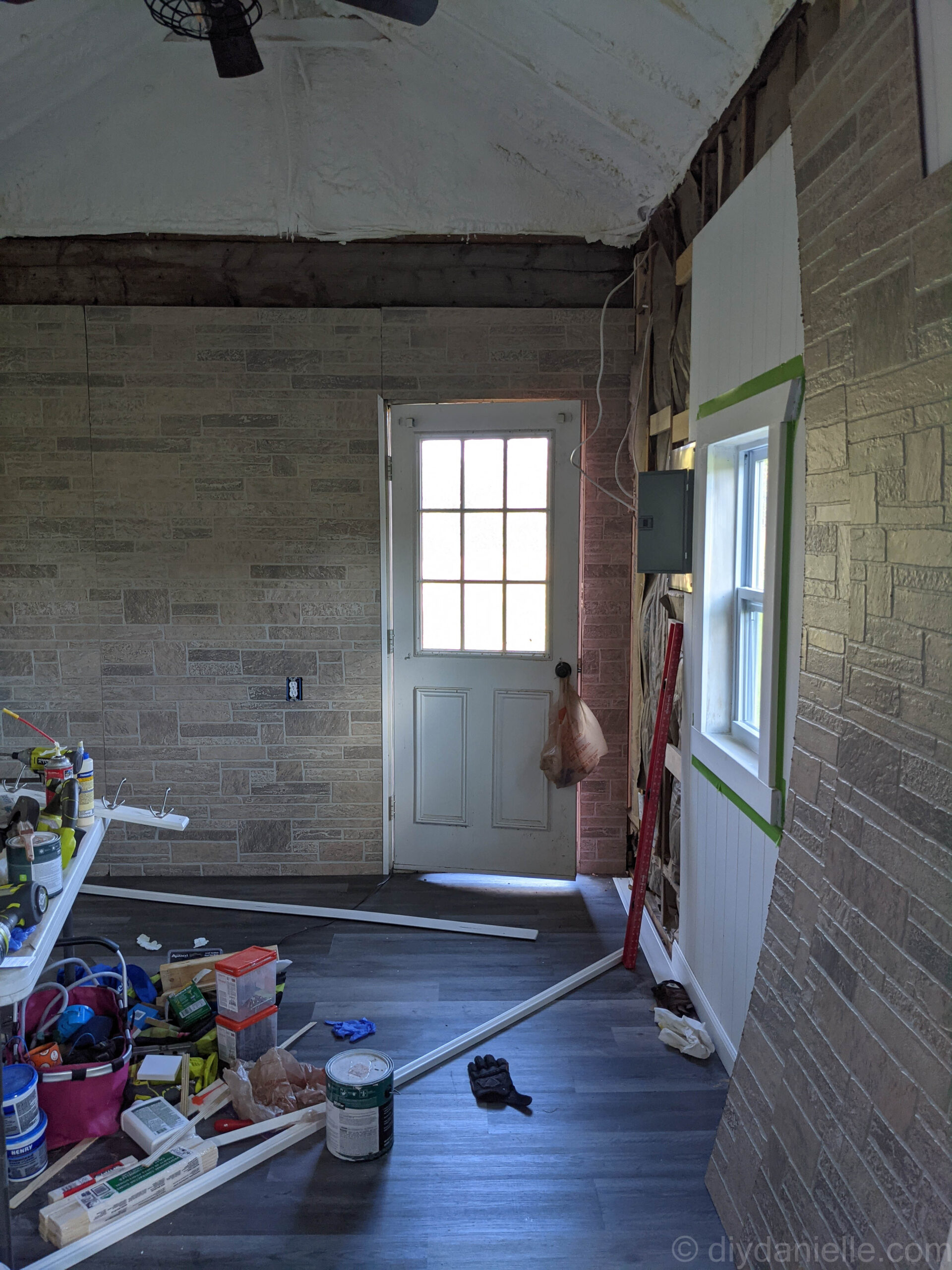 One piece of corner trim attached around the door frame. Note the the top of the left piece is angle so it can meet an angled piece of trim above the door. 