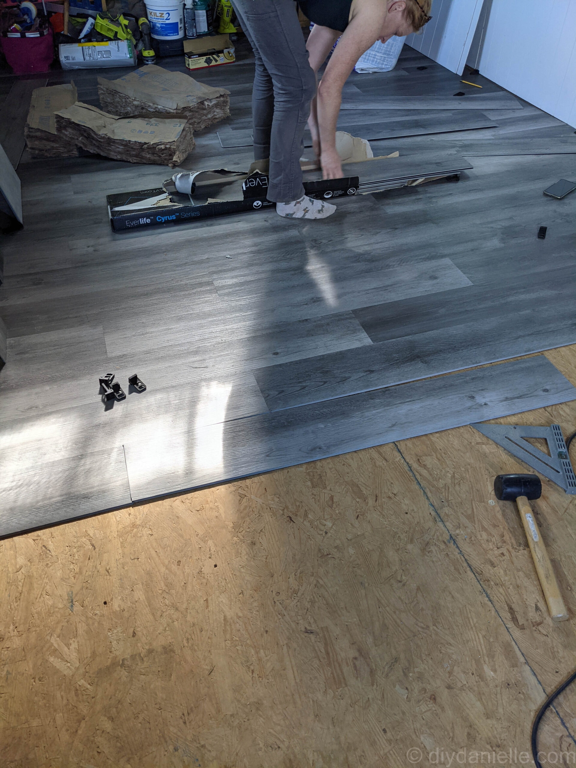 Close-up of vinyl plank flooring showing staggered pattern to avoid repetition.