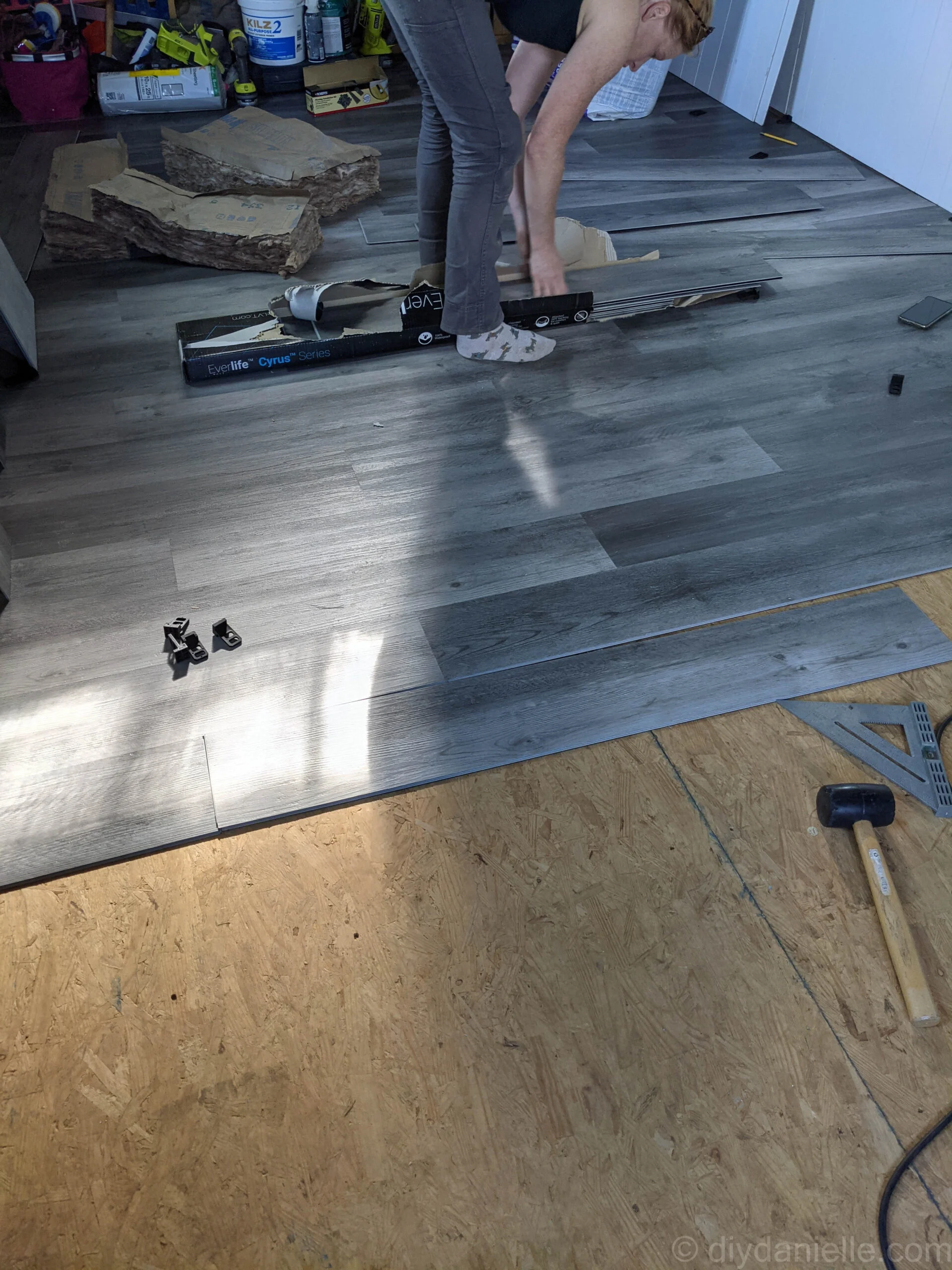 Close-up of vinyl plank flooring showing staggered pattern to avoid repetition.