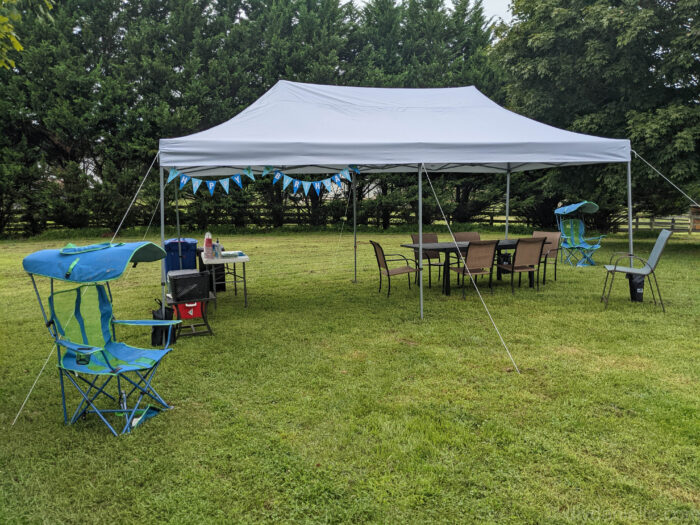 Large outdoor tent for hosting the party outdoors.