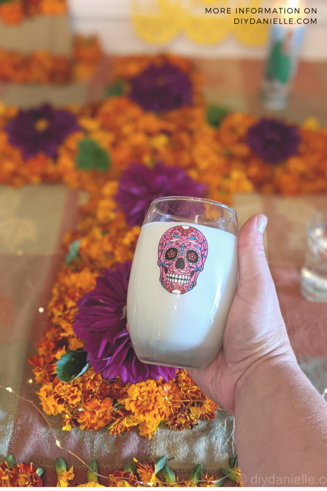 Soy candles that I made with Dollar Tree glasses for the Day of the Dead ofrenda.