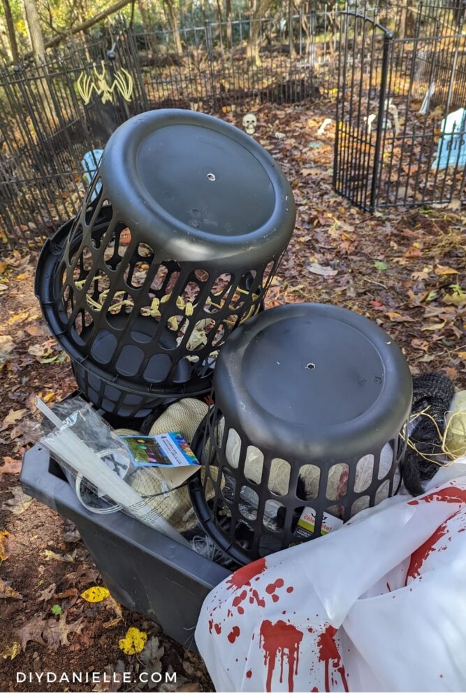 Laundry baskets painted black with a hole in the bottoms.