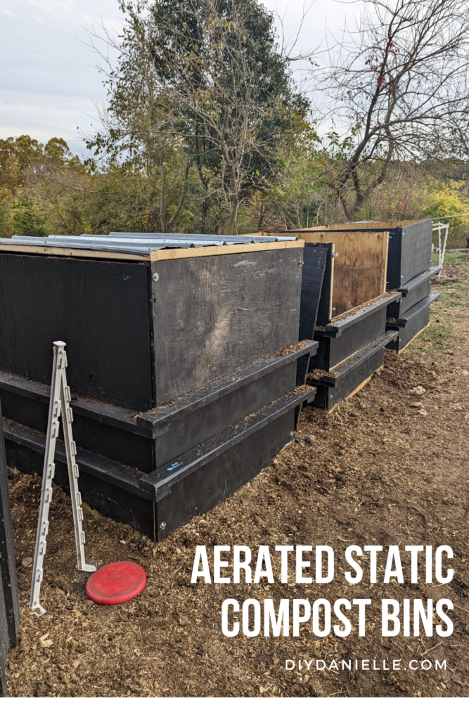 Three micro bins for aerated static composting of horse manure. The middle bin has half of the front removed to make it easier to fill.