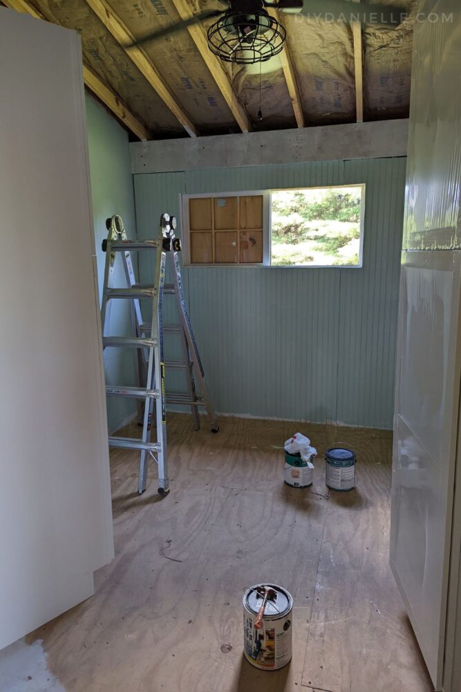 Barn tackroom with a plywood subfloor, prior to painting the floor.