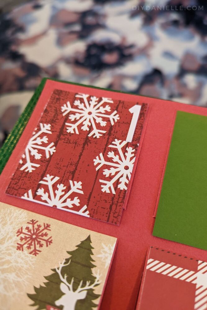 Number 1 in white Cricut Smart Sticker cardstock, used for numbering the window on an Advent Calendar.