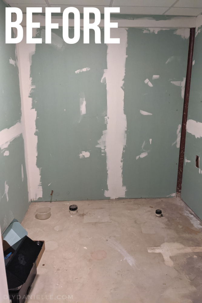 Before photo of a basement bathroom rough in.