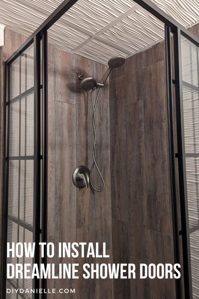 How to Install The Dreamline Shower Doors. Photo of the shower doors with black framing and a corner opening for a square shower.