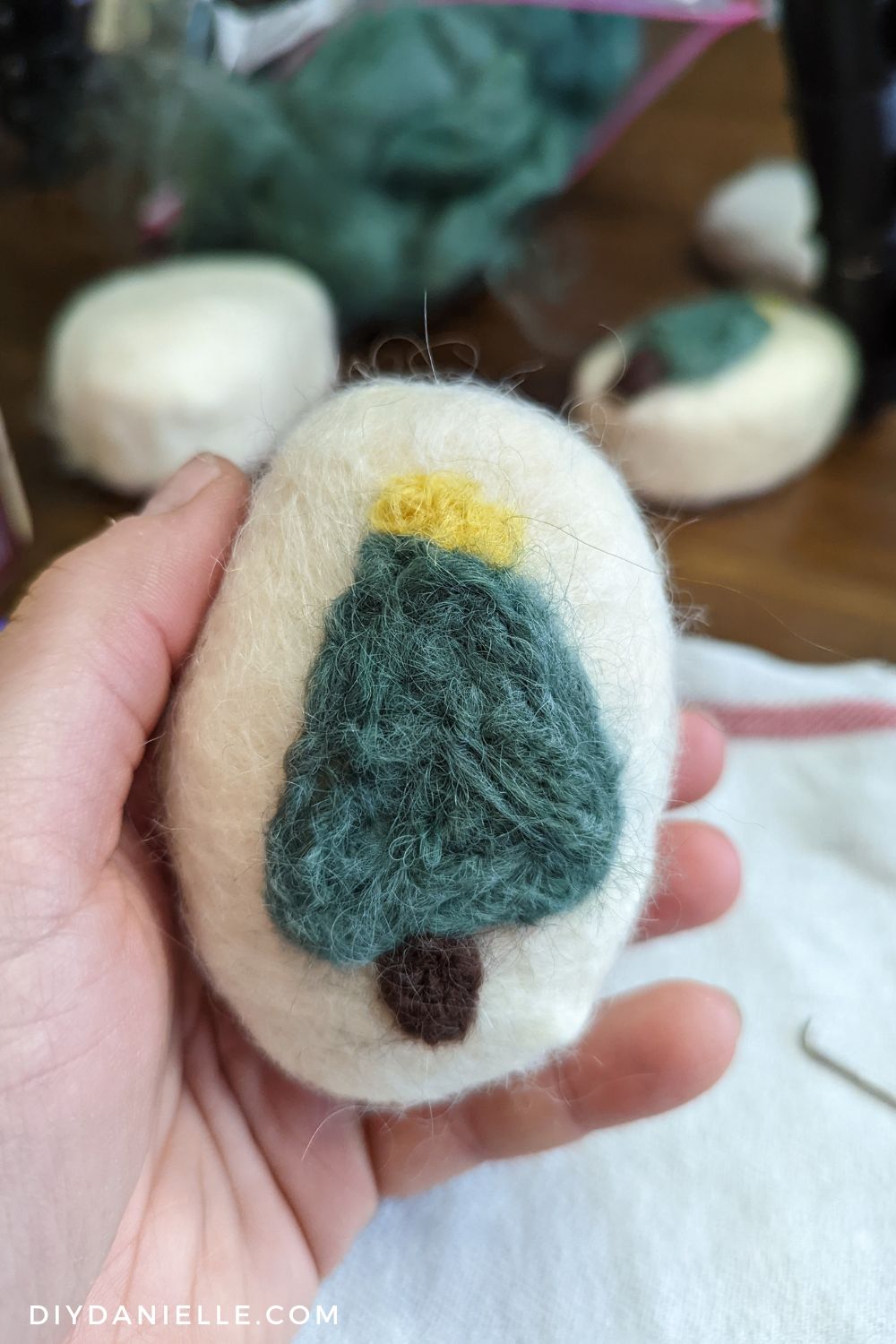 Felted Christmas Tree on a bar of soap done using both wet and dry felting process.