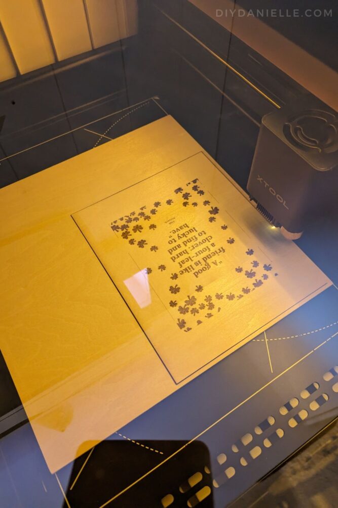 M1 Laser Cutter working on the back wood cover for a DIY card keeper.