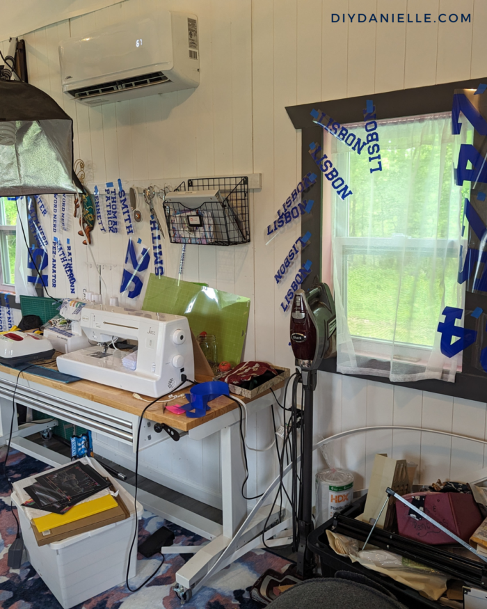 Team name, player names, and numbers for 16 baskeyball jerseys, all weeded and hung up with painters tape in my she shed.