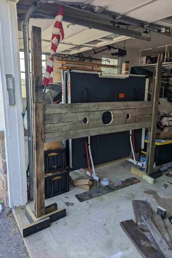 DIY pallet stocks standing up inside a garage. 
