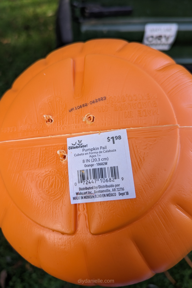 3 holes drilled in the bottom of a $1.98 plastic pumpkin.