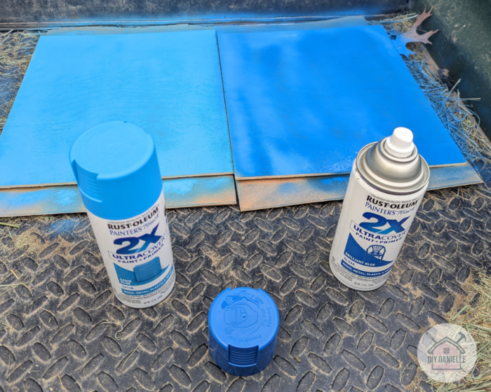 Two medium-sized pieces of plywood for the coaster box, painted light and dark blue with spray paint.