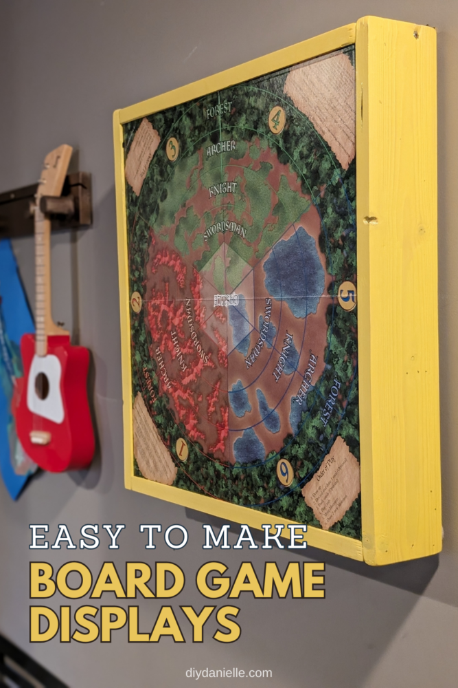 A framed board game display is easy to make and hangs on the wall for easy access.
