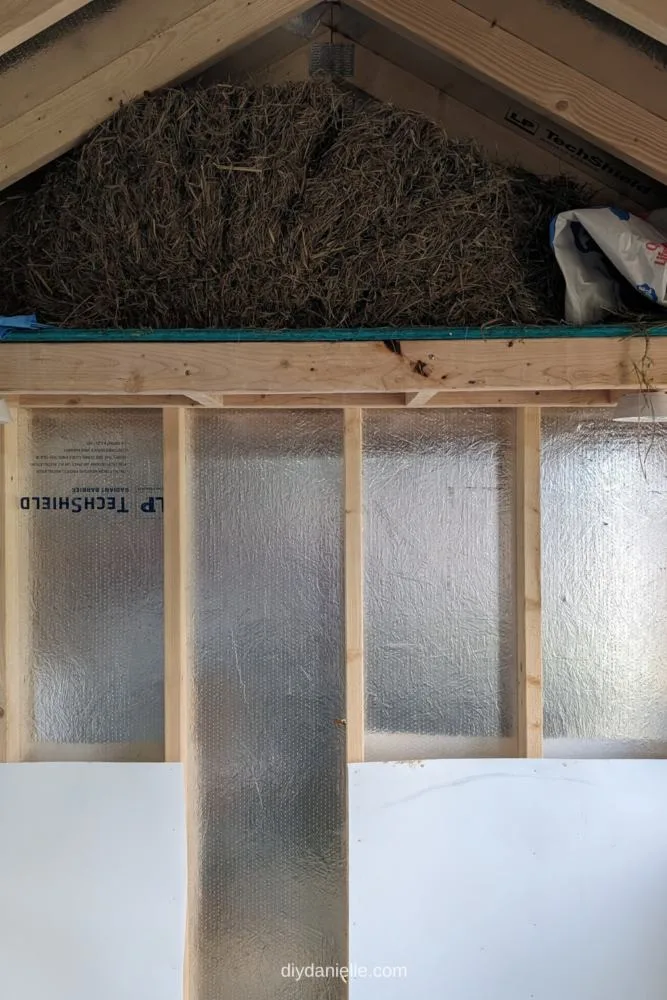 Handmade Loft in a shed that is currently holding a bale of hay.