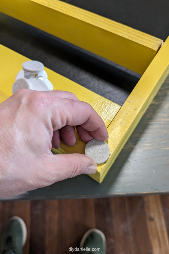 Add felt pads to the corners of the back of the display frame to protect walls and other surfaces.
