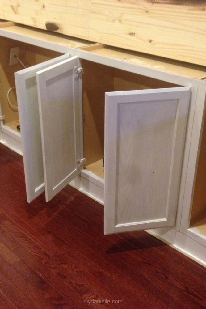 Cabinet doors with one coat of paint on them.