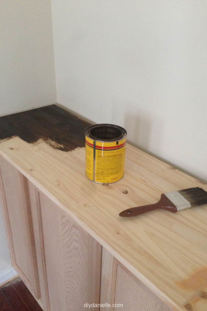 This is right when I began staining the wood countertops for the entertainment center. You can see the wood filler at the bottom right in the photo.