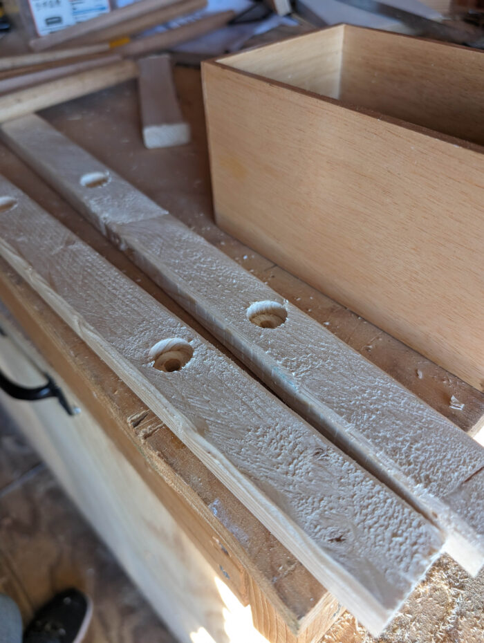 Holes added to 1x2s for the dowels to sit... these dowels will be the rungs of the towel ladder.