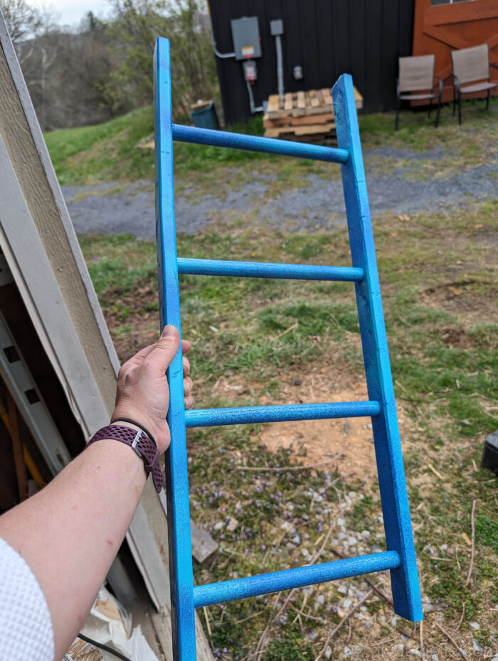 Painted towel ladder in shades of blue.