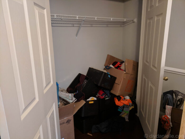 Messy kids closet shared for two kids before being renovated. 