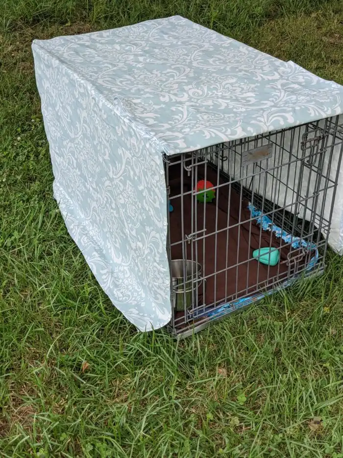 DIY dog crate cover fitted over crate to check sizing and fit.