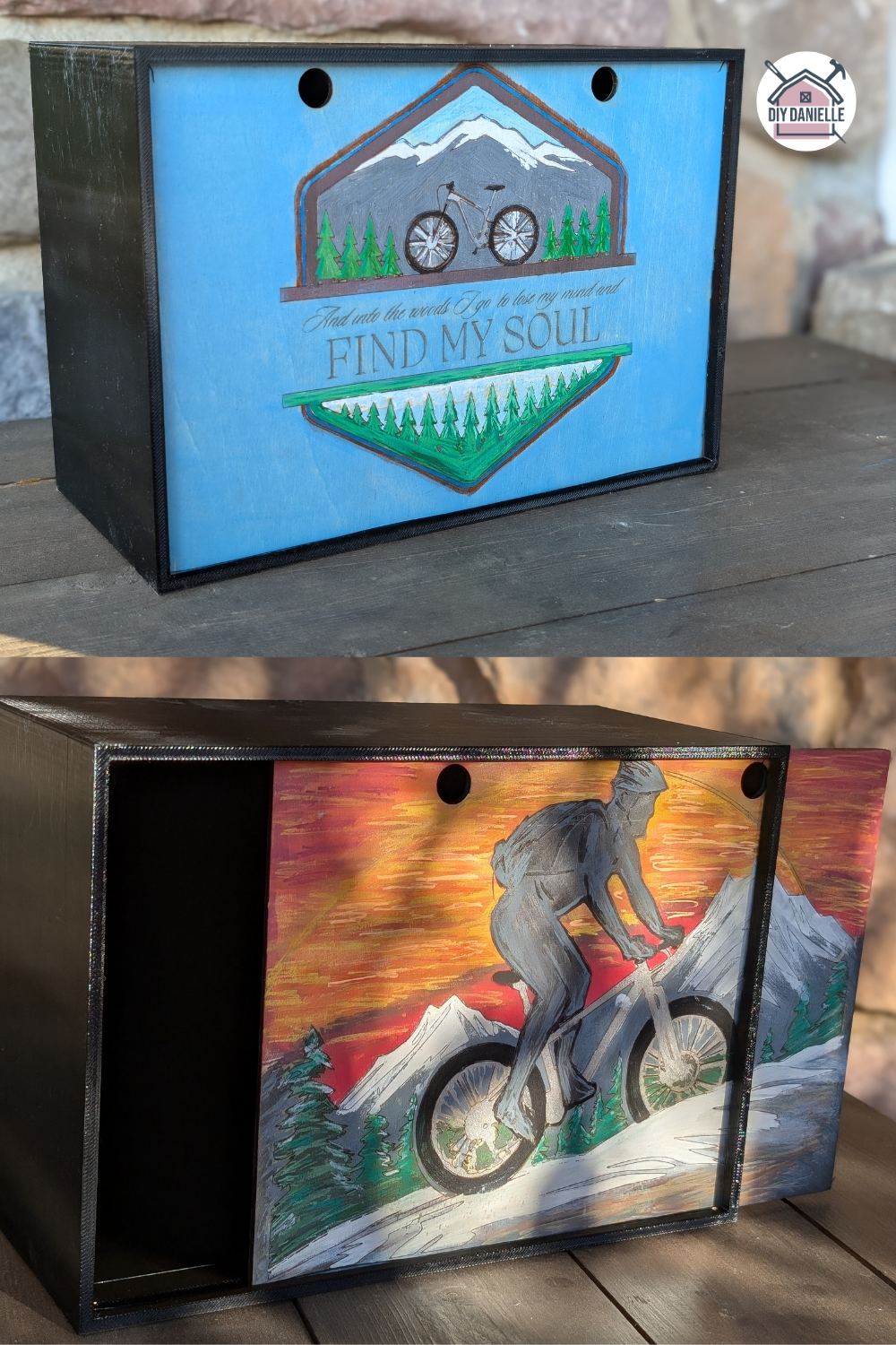 DIY Memory Box: The base is 3D print using black PETG filament, and the sliding lid is laser cut and engraved. The lid is reversible: the top photo is the blue side of the lid which has a mountain and bicycle with trees and the quote says "And into the woods I go to lose my mind and find my soul." The orange side has a man riding a mountain bike with a sunset and mountains and trees in the background. There's some snow on the ground. The man is more of a silhouette in tones of gray.