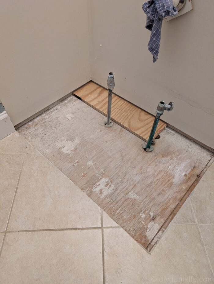 Building up the floor where the tiling wasn't continued originally. This was necessary as the new cabinets would wobble if we didn't fix this. We used scrap wood.