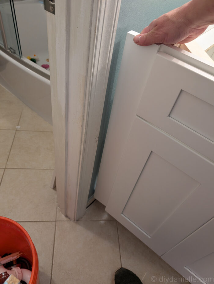 A piece of filler trim for next to the base vanity cabinet (white shaker). 