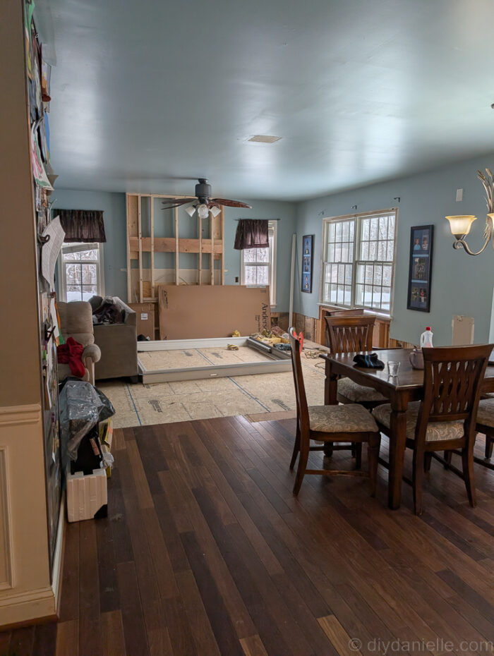 Original living room after the floor was raised and before the windows were removed.