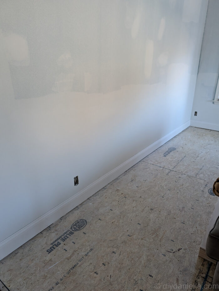 After this was all finished they had to repair the drywall and add baseboard. This was before the room got painted. They left a gap so that we can put flooring underneath if needed. We have not decided on a flooring option yet, so we're sticking with the subfloor for a bit. 