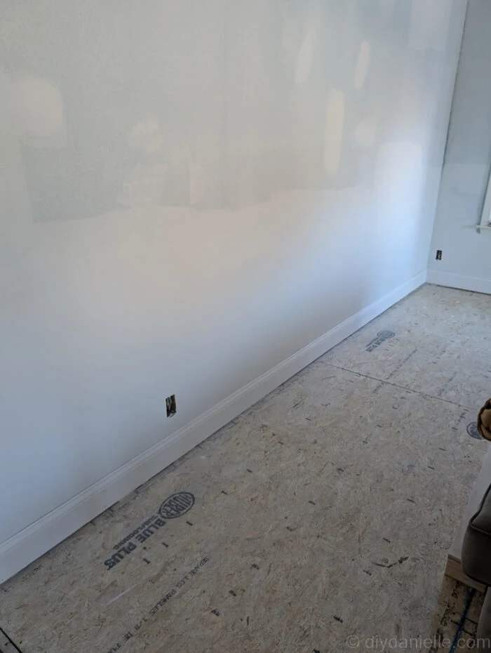 After this was all finished they had to repair the drywall and add baseboard. This was before the room got painted. They left a gap so that we can put flooring underneath if needed. We have not decided on a flooring option yet, so we're sticking with the subfloor for a bit.