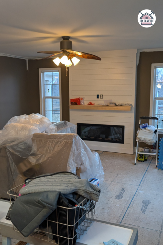 The raised floor with the new fireplace after raising the sunken living room floor.