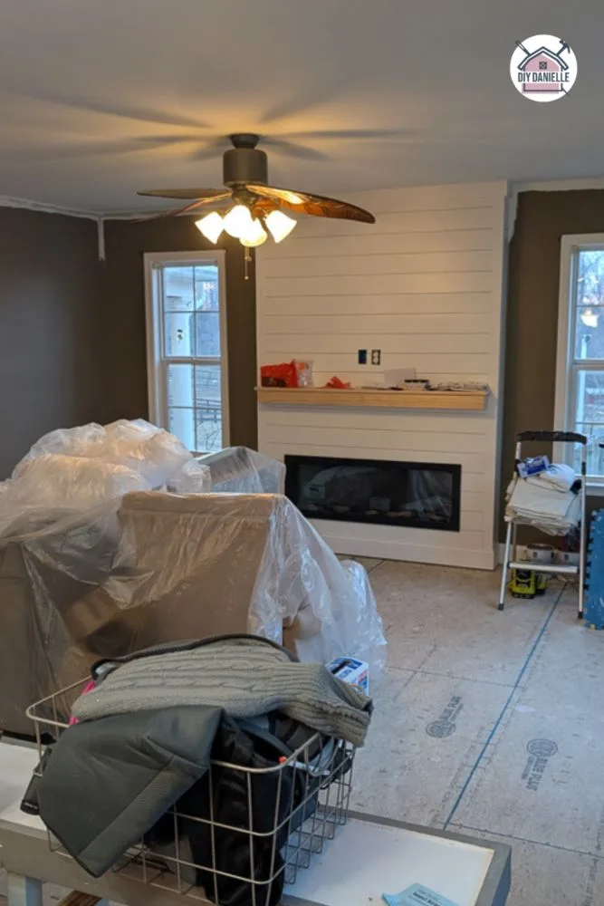 The raised floor with the new fireplace after raising the sunken living room floor.