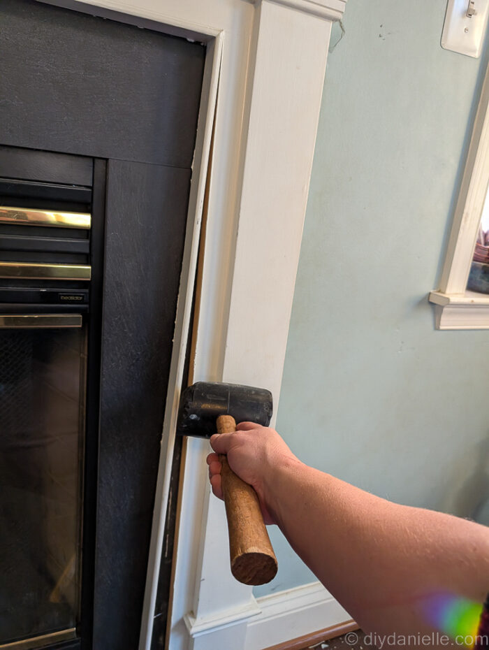 Hehe, demo! I'm removing trim using a mallet.