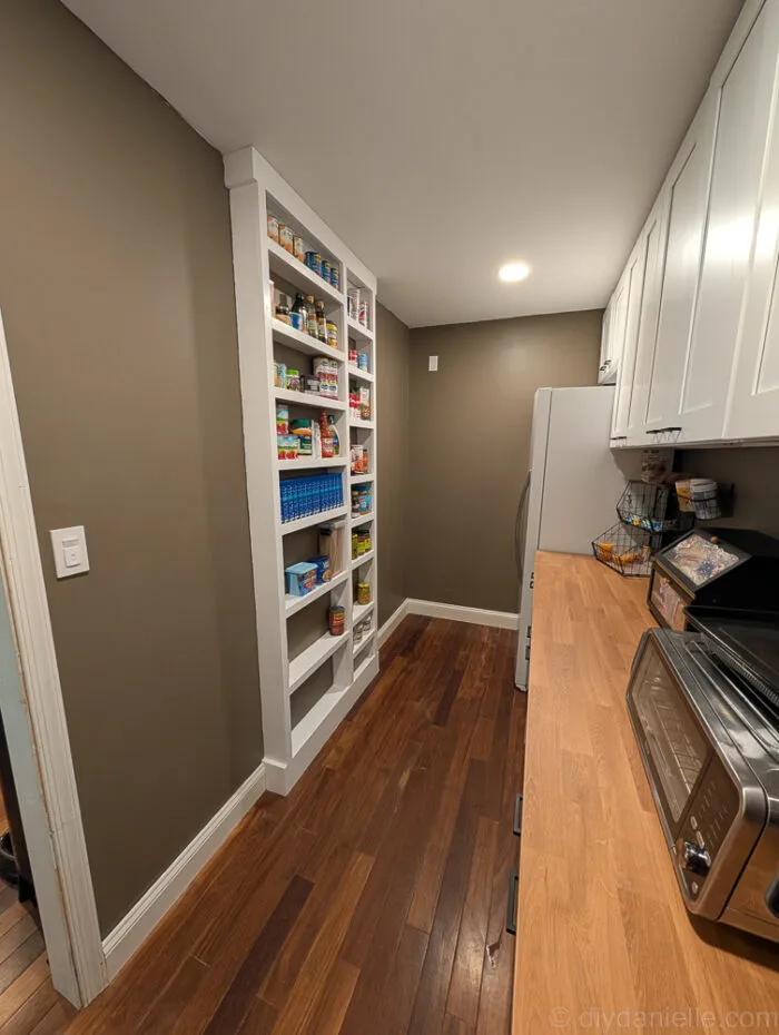 View of the shelves from the opposite angle, showing the full setup with the trim and shelves in place.