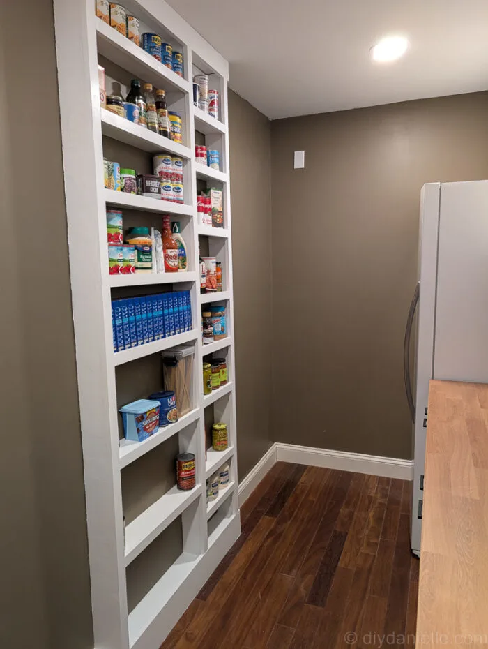 Close-up of shelves showing areas without caulk, where the addition of caulk will create a more finished appearance.