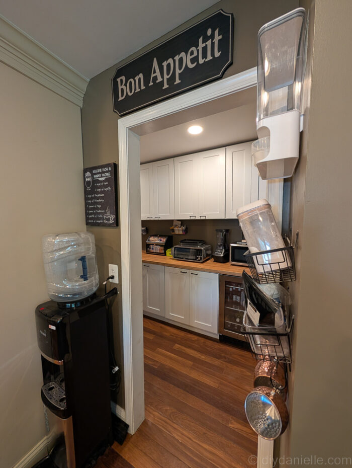 Completed pantry renovation with ample shelving, a freezer, and organized storage for a more functional space