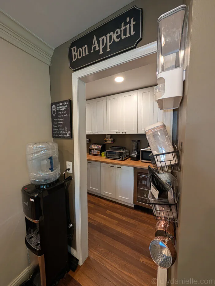 Completed pantry renovation with ample shelving, a freezer, and organized storage for a more functional space