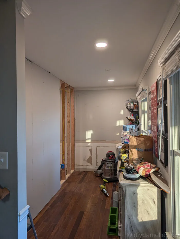 The future hallway/mudroom side of the wall: framed and partially drywalled.