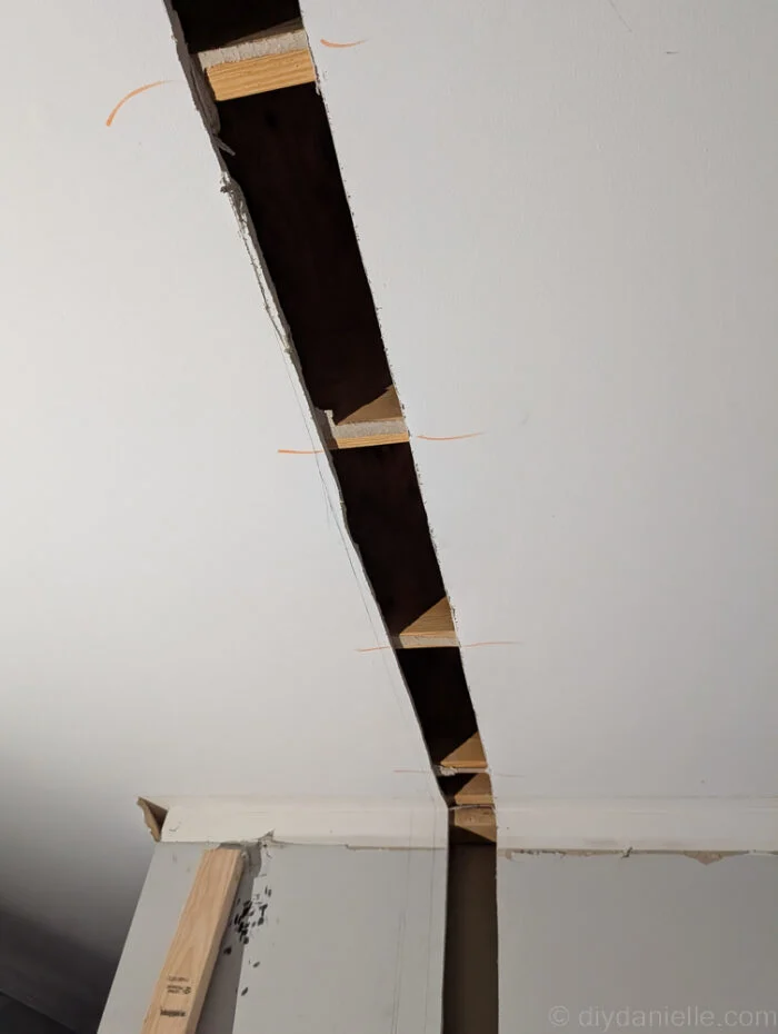 Old drywall cut away to prepare to place our new divider wall and framing.