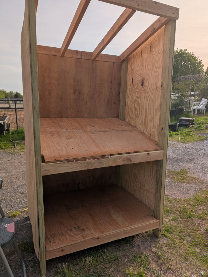 Wood boards cut and ready to install as the countertop and bottom shelf for a DIY farm stand.