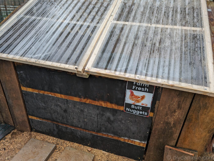 DIY feed shed with 2x4 center support added under clear hinged lid to prevent sagging.