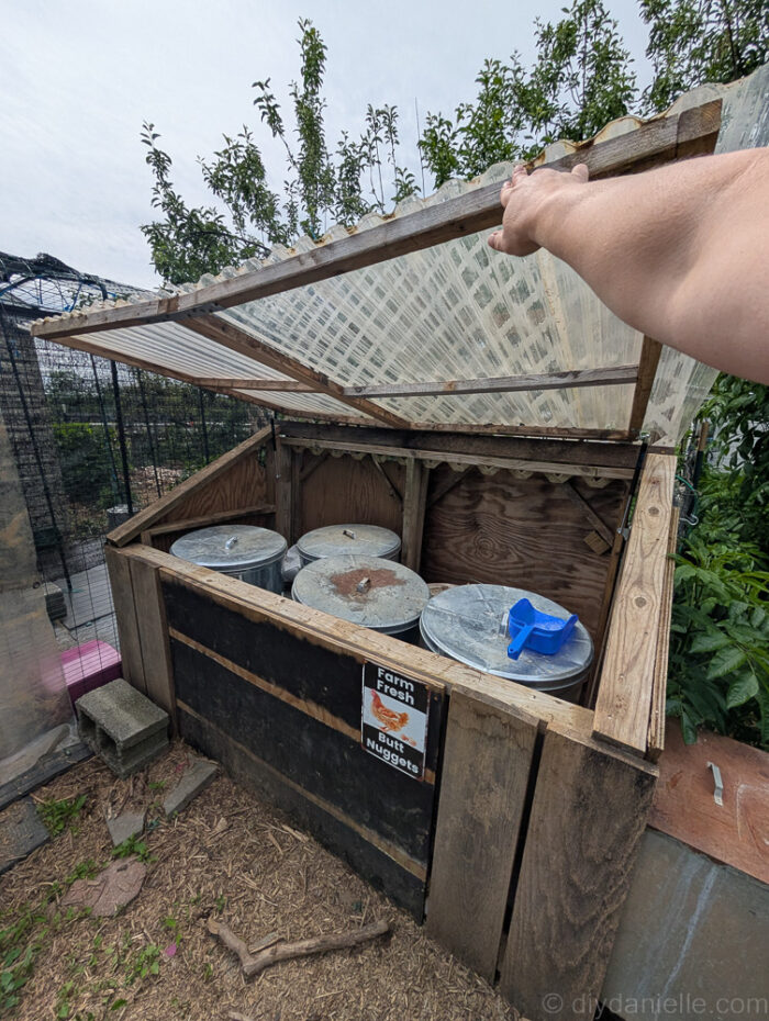 DIY feed shed made with unpainted and pre-painted wood for low-maintenance farm use.