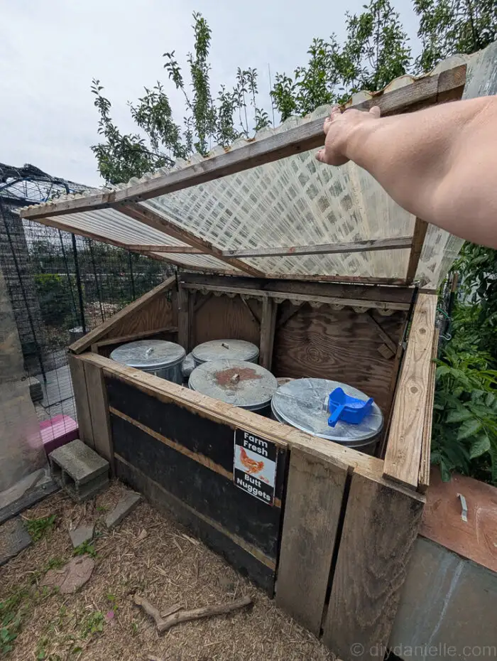 DIY feed shed made with unpainted and pre-painted wood for low-maintenance farm use.