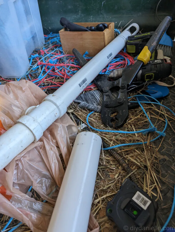 PVC setup inside the bog filter trough with drilled holes and capped ends, ready to connect to the pond pump