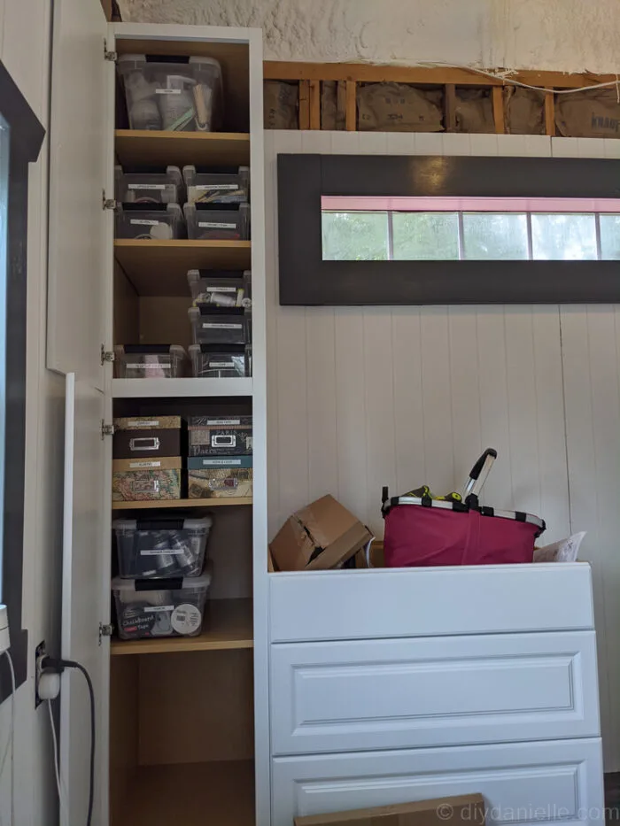 Organized kitchen cabinets with neatly stored items