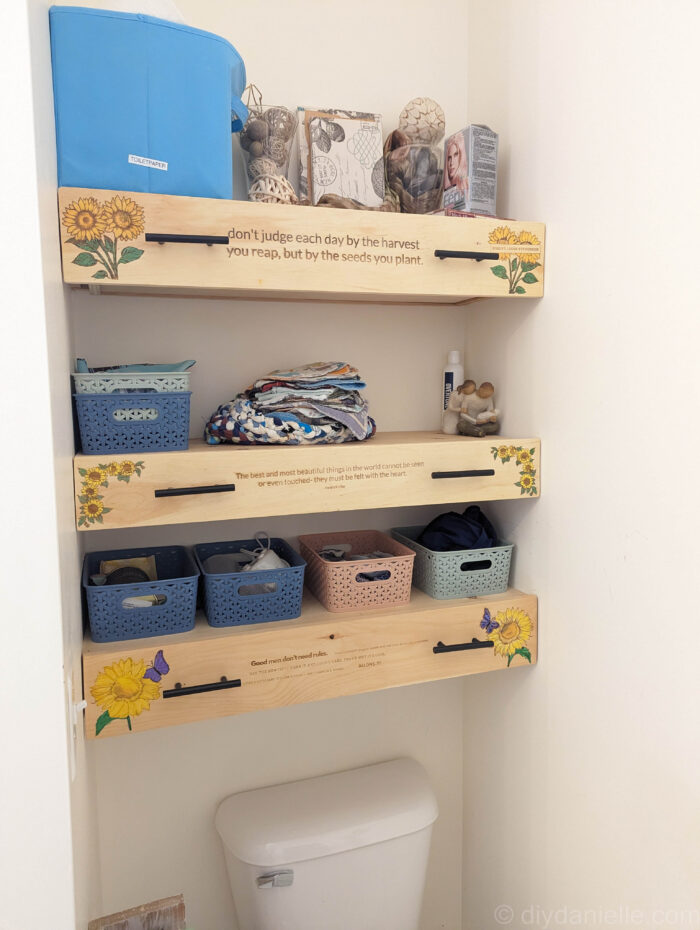 Completed DIY wooden drawers with small storage baskets on open shelves, showcasing a clean and organized finish.